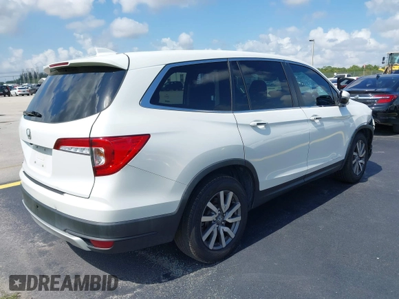 2020 Honda Pilot EX-L with VIN 5FNYF5H59LB028268, listed as a IAAI auction lot 42355620 with 107,033 mi miles and . Bid and sale history available at DreamBid. Image 4.