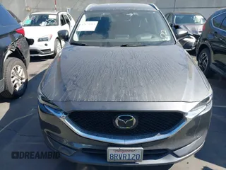 2020 Mazda CX-5 Grand Touring with VIN JM3KFADM3L1812649, listed as a IAAI auction lot 42575393 with 102,118 mi miles and . Bid and sale history available at DreamBid. Image 13.