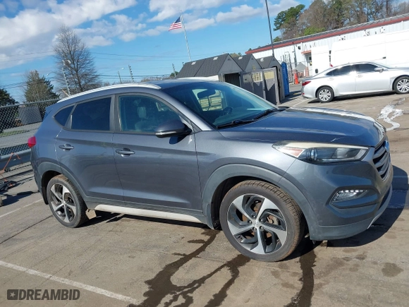 2017 Hyundai Tucson Value with VIN KM8J33A25HU402366, listed as a IAAI auction lot 41814426 with 117,669 mi miles. Bid and sale history available at carsss.com. Image 13.