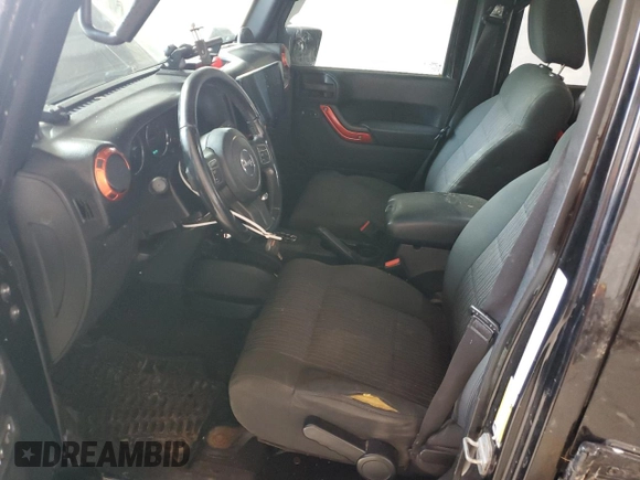 2012 Jeep Wrangler Unlimited Sahara with VIN 1C4BJWEG3CL195271, listed as a Copart auction lot 59947235 with 212,819 mi miles and Salvage title. Bid and sale history available at DreamBid. Image 7.