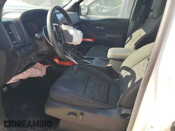 2023 Nissan Frontier Pro-X with VIN 1N6ED1EJ6PN661933, listed as a Copart auction lot 52496135 with 28,533 mi miles and Salvage title. Bid and sale history available at DreamBid. Image 7.