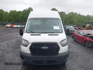 2021 Ford Transit Cargo with VIN 1FTBW1X84MKA98047, listed as a IAAI auction lot 42313747 with 65,600 mi miles and . Bid and sale history available at DreamBid. Image 12.