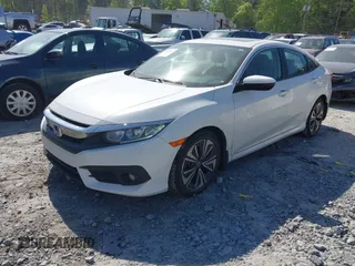 2018 Honda Civic EX-L z VIN 19XFC1F70JE000634, wystawiony jako IAAI lot #42020912 z przebiegiem 156 030 mil mil oraz . Historia ofert i sprzedaży dostępna na DreamBid. Obrazek 17.
