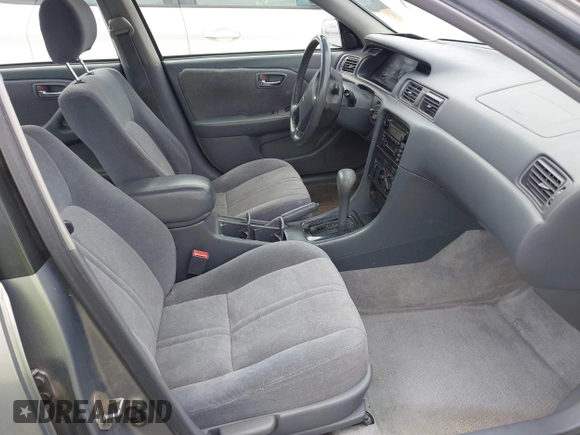 2001 Toyota Camry CE z VIN JT2BG22K410587070, wystawiony jako IAAI lot #42388043 z przebiegiem 119 183 mil mil oraz . Historia ofert i sprzedaży dostępna na DreamBid. Obrazek 5.