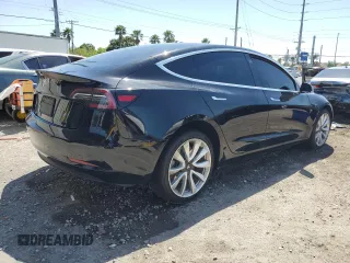 2019 Tesla Model 3 Mid Range z VIN 5YJ3E1EA9KF314143, wystawiony jako Copart lot #53564335 z przebiegiem 77 168 mil mil oraz Szkoda całkowita • Salvage title. Historia ofert i sprzedaży dostępna na DreamBid. Obrazek 3.