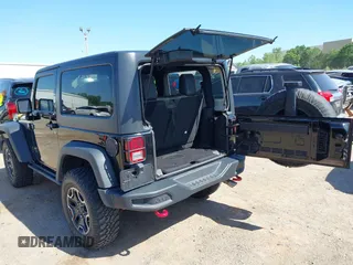 2015 Jeep Wrangler Rubicon Hard Rock with VIN 1C4BJWCG1FL610028, listed as a IAAI auction lot 42318569 with 48,627 mi miles and . Bid and sale history available at DreamBid. Image 3.