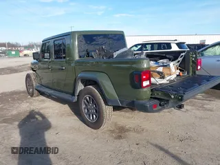 2023 Jeep Gladiator Overland z VIN 1C6HJTFG9PL507484, wystawiony jako IAAI lot #41486457 z przebiegiem 54 871 mil mil oraz . Historia ofert i sprzedaży dostępna na DreamBid. Obrazek 3.