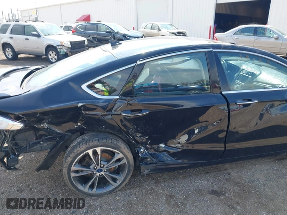 2020 Ford Fusion Titanium with VIN 3FA6P0D9XLR174523, listed as a IAAI auction lot 42100113 with 100,602 mi miles and . Bid and sale history available at DreamBid. Image 6.