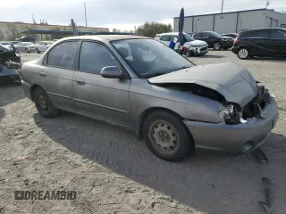 2003 Kia Spectra with VIN KNAFB121935265035, listed as a Copart auction lot 86407934 with 201,586 mi miles and Salvage Title. Bid and sale history available at DreamBid. Image 4.