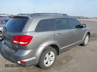 2012 Dodge Journey SXT z VIN 3C4PDCBG9CT208092, wystawiony jako IAAI lot #42065471 z przebiegiem 208 794 mil mil oraz . Historia ofert i sprzedaży dostępna na DreamBid. Obrazek 4.