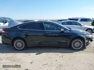 2014 Ford Fusion Titanium Hybrid with VIN 3FA6P0RU9ER111834, listed as a IAAI auction lot 41570337 with 121,099 mi miles. Bid and sale history available at carsss.com. Image 13.