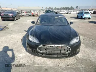 2014 Tesla Model S 60 с VIN 5YJSA1H16EFP40654, выставлен на аукционе Copart как лот 72070974 с пробегом Не указан миль и Списание • Salvage title. История ставок и продаж доступна на DreamBid. Изображение 11.