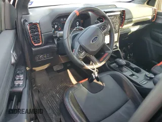 2024 Ford Ranger Raptor with VIN 1FTER4LR1RLE23193, listed as a Copart auction lot 77737244 with 12,283 mi miles and Salvage Title. Bid and sale history available at carsss.com. Image 8.