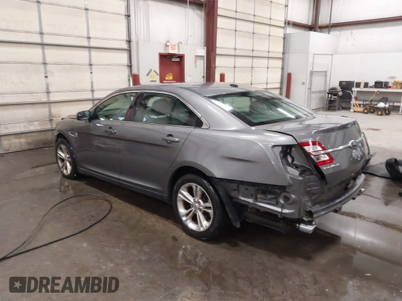 2013 Ford Taurus SEL with VIN 1FAHP2E86DG177504, listed as a IAAI auction lot 42071852 with 130,547 mi miles and . Bid and sale history available at carsss.com. Image 3.