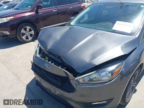 2018 Ford Focus SE with VIN 1FADP3FE3JL204220, listed as a IAAI auction lot 41972960 with 62,682 mi miles and . Bid and sale history available at DreamBid. Image 6.