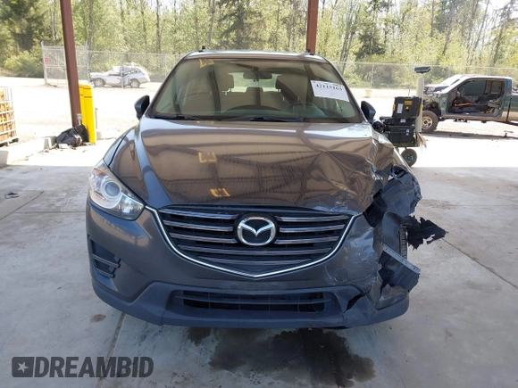 2016 Mazda CX-5 Sport with VIN JM3KE4BY1G0910102, listed as a IAAI auction lot 42115163 with 144,495 mi miles and . Bid and sale history available at carsss.com. Image 13.