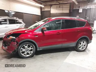 2014 Ford Escape Titanium with VIN 1FMCU9J9XEUD69589, listed as a IAAI auction lot 42031882 with 123,632 mi miles and . Bid and sale history available at DreamBid. Image 14.