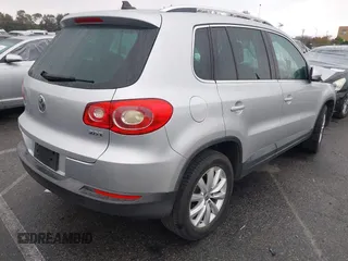 2011 Volkswagen Tiguan SEL w/Premium Navi with VIN WVGAV7AX7BW547613, listed as a IAAI auction lot 41916574 with 140,385 mi miles and . Bid and sale history available at DreamBid. Image 4.