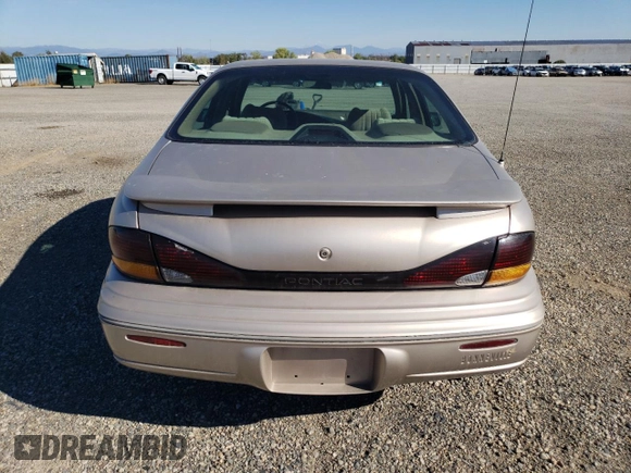 1999 Pontiac Bonneville SE z VIN 1G2HX52K4XH247855, wystawiony jako Copart lot #72559044 z przebiegiem 160 677 mil mil oraz Szkoda całkowita • Salvage title. Historia ofert i sprzedaży dostępna na DreamBid. Obrazek 6.