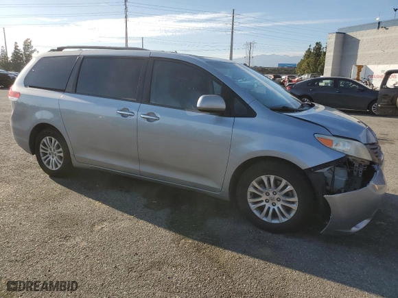 2014 Toyota Sienna XLE with VIN 5TDYK3DC8ES472826, listed as a Copart auction lot 46174385 with 129,094 mi miles and Salvage Title. Bid and sale history available at carsss.com. Image 4.