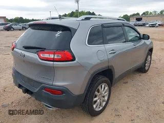 2015 Jeep Cherokee Limited with VIN 1C4PJMDS3FW706058, listed as a IAAI auction lot 41951302 with 163,404 mi miles. Bid and sale history available at carsss.com. Image 4.