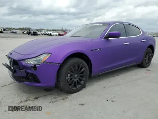 2014 Maserati Ghibli z VIN ZAM57XSA6E1082006, wystawiony jako Copart lot #51713165 z przebiegiem 124 005 mil mil oraz Szkody całkowita. Historia ofert i sprzedaży dostępna na DreamBid. Obrazek 1.