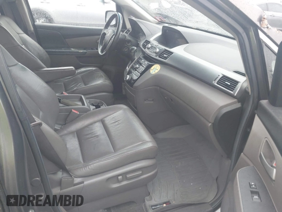 2012 Honda Odyssey EX-L with VIN 5FNRL5H64CB037689, listed as a IAAI auction lot 41857822 with 121,601 mi miles and . Bid and sale history available at carsss.com. Image 5.