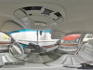 1994 Cadillac DeVille z VIN 1G6KD52B7RU290139, wystawiony jako Copart lot #46899465 z przebiegiem 133 110 mil mil oraz Czysty tytuł • Clean title. Historia ofert i sprzedaży dostępna na DreamBid. Obrazek 13.
