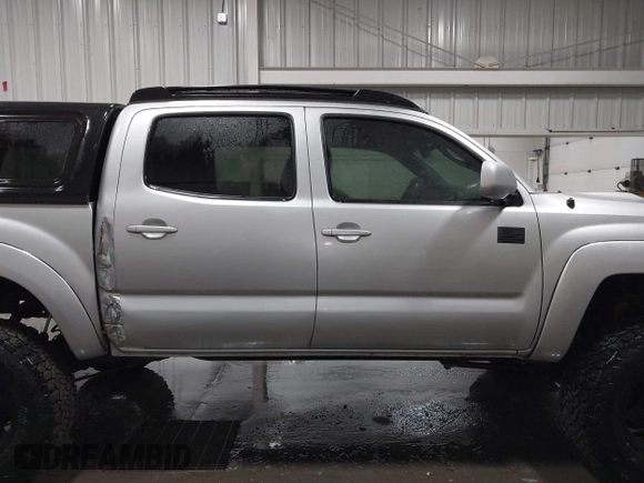 2011 Toyota Tacoma with VIN 3TMLU4EN9BM070836, listed as a IAAI auction lot 41668595 with 89,879 mi miles and . Bid and sale history available at DreamBid. Image 13.