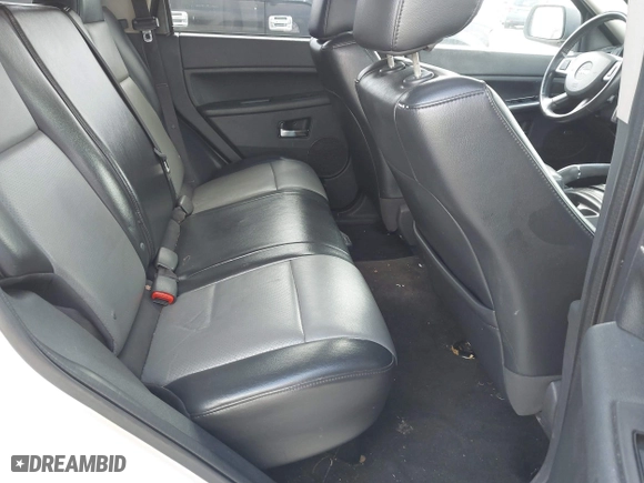 2010 Jeep Grand Cherokee Laredo with VIN 1J4PR4GK0AC151711, listed as a IAAI auction lot 41940295 with 185,684 mi miles. Bid and sale history available at carsss.com. Image 8.
