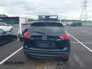 2016 Mazda CX-5 Grand Touring with VIN JM3KE2DYXG0890174, listed as a IAAI auction lot 42157884 with 141,873 mi miles. Bid and sale history available at carsss.com. Image 16.
