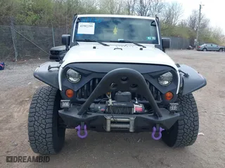 2012 Jeep Wrangler Unlimited Sahara with VIN 1C4BJWEG9CL220965, listed as a IAAI auction lot 41902295 with 120,492 mi miles. Bid and sale history available at carsss.com. Image 13.