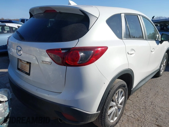 2016 Mazda CX-5 Touring z VIN JM3KE2CY9G0807688, wystawiony jako IAAI lot #41039438 z przebiegiem 169 483 mil mil oraz . Historia ofert i sprzedaży dostępna na DreamBid. Obrazek 4.