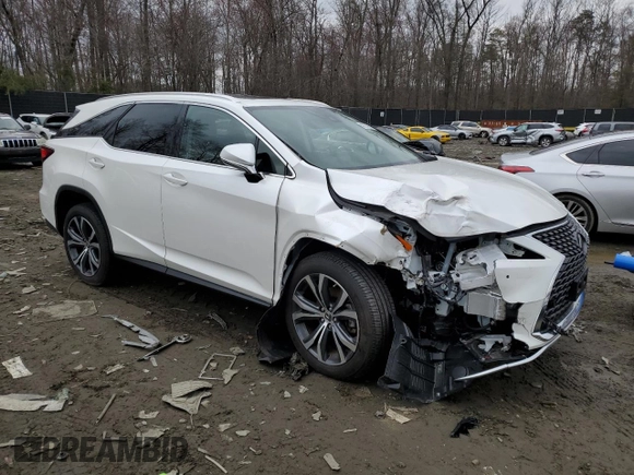 2022 Lexus RX with VIN JTJHZKFA5N2039857, listed as a Copart auction lot 42733963 with 7,011 mi miles. Bid and sale history available at carsss.com. Image 4.