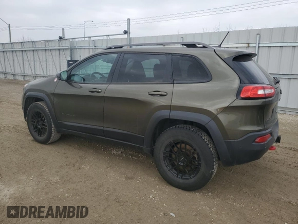 2015 Jeep Cherokee Trailhawk with VIN 1C4PJMBS0FW678738, listed as a Copart auction lot 50651235 with 147,793 mi miles and Salvage title. Bid and sale history available at DreamBid. Image 2.