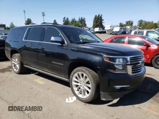 2019 Chevrolet Suburban Premier with VIN 1GNSKJKJ1KR151983, listed as a Copart auction lot 68709074 with 86,611 mi miles and Salvage Title. Bid and sale history available at DreamBid. Image 4.