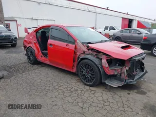 2015 Subaru WRX STI z VIN JF1VA2P64F9832735, wystawiony jako IAAI lot #41787602 z przebiegiem 134 295 mil mil oraz . Historia ofert i sprzedaży dostępna na DreamBid. Obrazek 1.