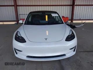 2021 Tesla Model 3 Long Range with VIN 5YJ3E1EB3MF003027, listed as a IAAI auction lot 41859036 with 102,302 mi miles and . Bid and sale history available at carsss.com. Image 13.