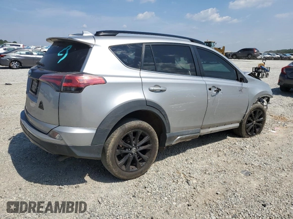 2018 Toyota RAV4 XLE with VIN 2T3WFREVXJW427748, listed as a Copart auction lot 61833055 with 104,057 mi miles and Salvage title. Bid and sale history available at DreamBid. Image 3.