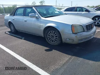 2003 Cadillac DeVille DHS z VIN 1G6KE54Y73U148136, wystawiony jako IAAI lot #42006486 z przebiegiem Nie podano mil oraz . Historia ofert i sprzedaży dostępna na DreamBid. Obrazek 1.