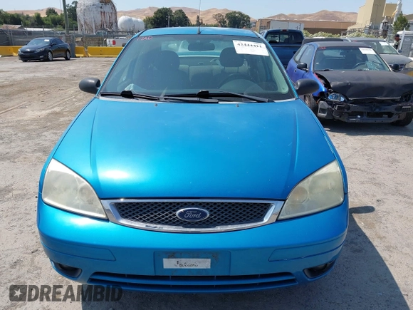 2007 Ford Focus S z VIN 1FAHP34N77W333895, wystawiony jako IAAI lot #42444411 z przebiegiem 155 522 mil mil oraz . Historia ofert i sprzedaży dostępna na DreamBid. Obrazek 6.