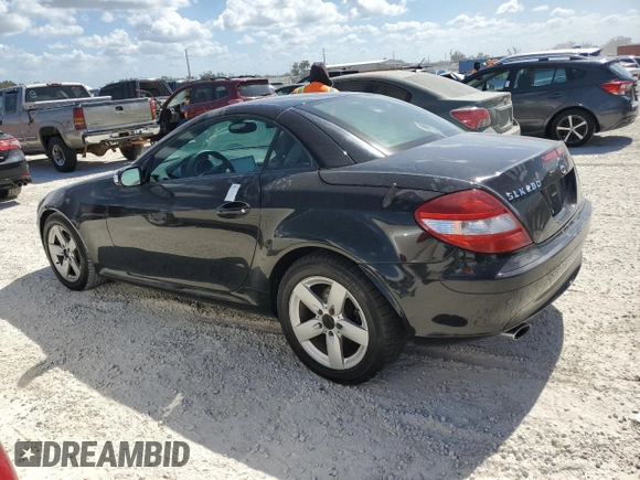 2006 Mercedes-Benz SLK-Class 3.0L with VIN WDBWK54F66F102164, listed as a Copart auction lot 77269014 with 135,786 mi miles and Salvage Title. Bid and sale history available at carsss.com. Image 2.
