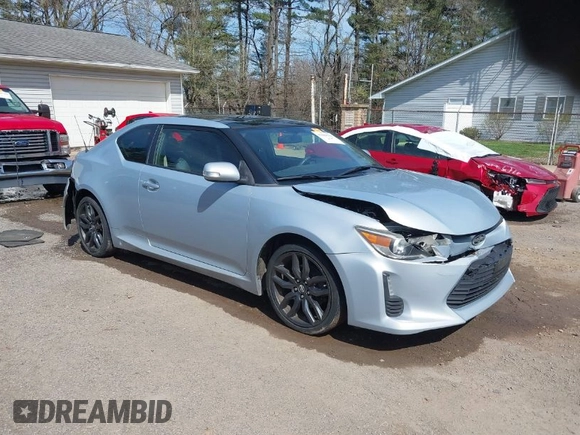 2014 Scion tC with VIN JTKJF5C70E3068144, listed as a IAAI auction lot 41983751 with 137,894 mi miles. Bid and sale history available at carsss.com. Image 1.
