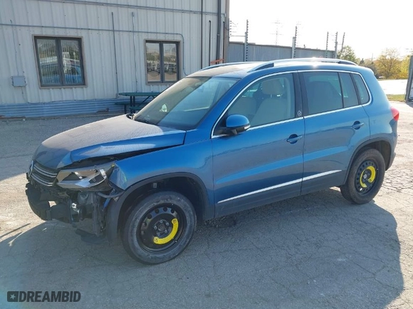 2017 Volkswagen Tiguan Wolfsburg Edition with VIN WVGRV7AX0HW502041, listed as a IAAI auction lot 31232130 with 30,214 mi miles. Bid and sale history available at carsss.com. Image 2.