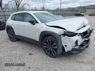 2023 Mazda CX-50 S Premium Plus with VIN 7MMVABEM7PN108865, listed as a IAAI auction lot 42049215 with 33,285 mi miles and . Bid and sale history available at DreamBid. Image 1.