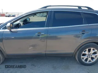 2015 Mazda CX-9 Sport with VIN JM3TB2BA7F0465965, listed as a IAAI auction lot 40348982 with 165,284 mi miles and . Bid and sale history available at carsss.com. Image 14.