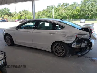 2016 Ford Fusion Titanium with VIN 3FA6P0K96GR390989, listed as a IAAI auction lot 42634275 with 123,559 mi miles and . Bid and sale history available at DreamBid. Image 14.