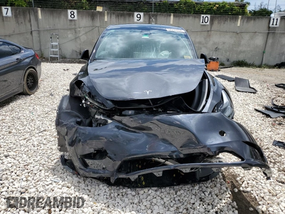 2024 Tesla Model Y with VIN 7SAYGDED2RF040079, listed as a Copart auction lot 57237054 with 2,549 mi miles and Non Repairable. Bid and sale history available at DreamBid. Image 5.