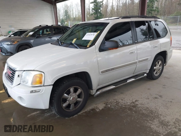 2003 GMC Envoy SLE with VIN 1GKDT13SX32319740, listed as a IAAI auction lot 41923578 with 210,811 mi miles. Bid and sale history available at carsss.com. Image 17.
