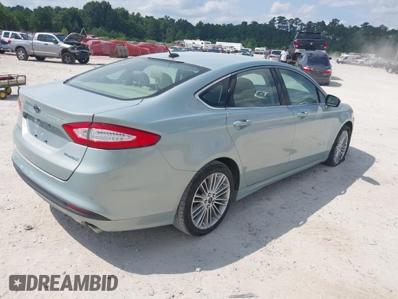 2013 Ford Fusion SE Hybrid z VIN 3FA6P0LU8DR265460, wystawiony jako IAAI lot #42720385 z przebiegiem 146 179 mil mil oraz . Historia ofert i sprzedaży dostępna na DreamBid. Obrazek 4.